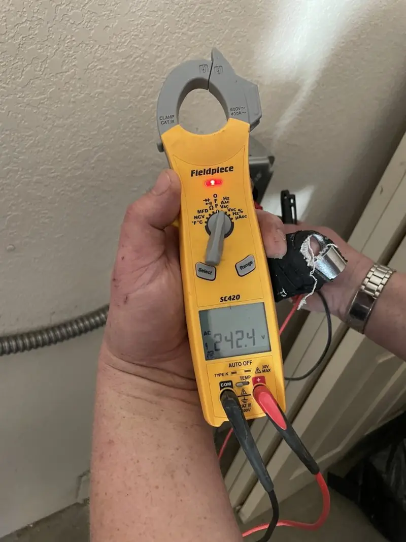Voltage testing with clamp meter during Hot Tub / Pool Electrical Wiring in Northwood